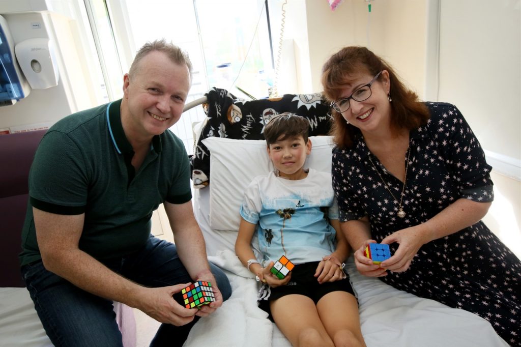 Picture of Matt Cooper and Ann-Marie O'Sullivan with a child at Crumlin Hospital