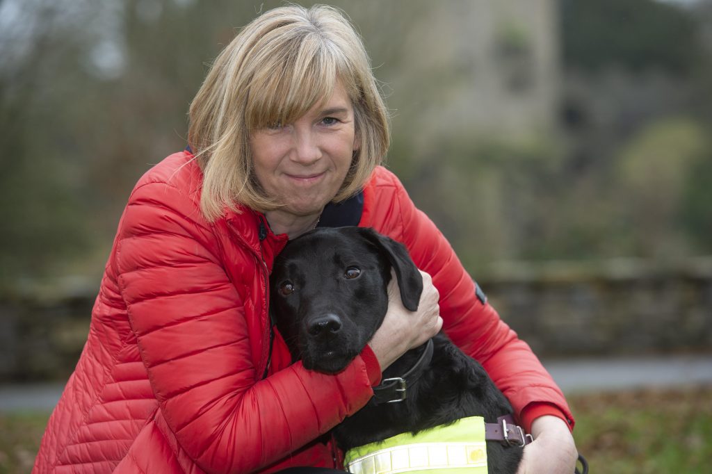 April 2020 Cork Person of the Month winner community activist Kate Durrant picture with her dog Hugo at Blarney castle